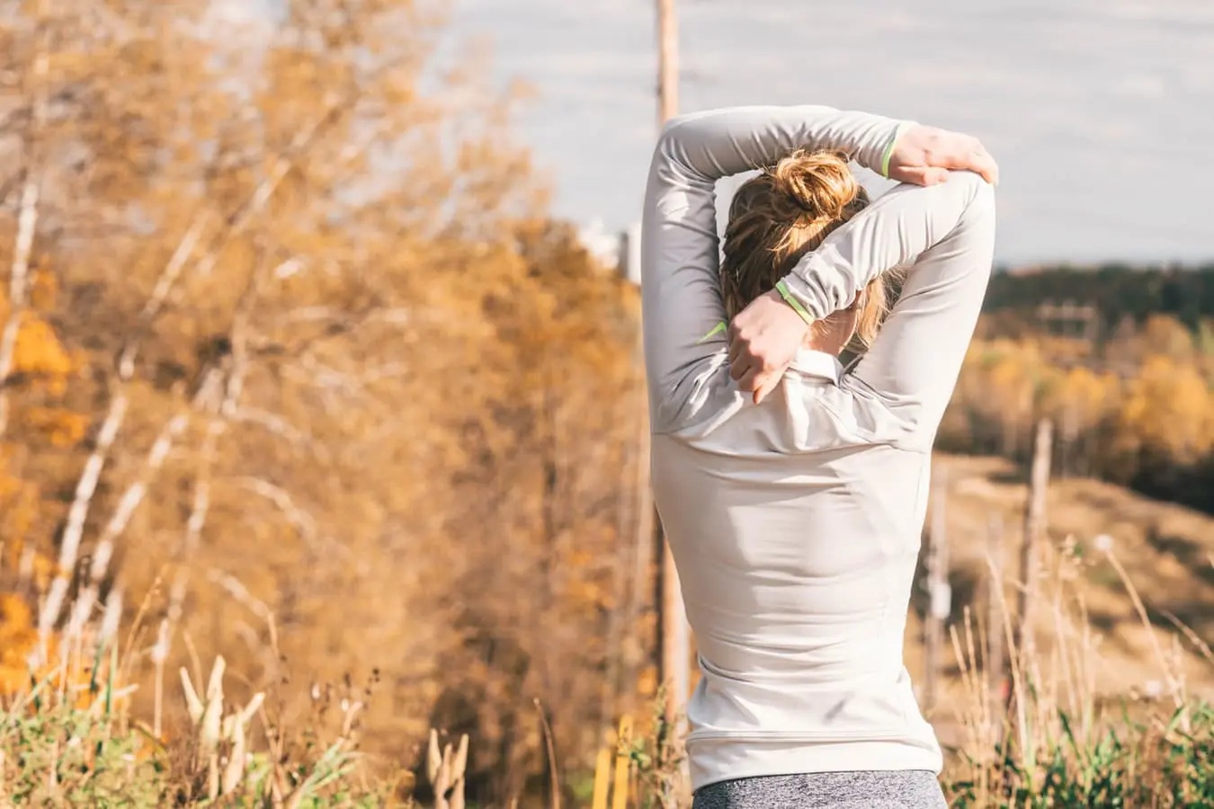 Chiropractic Huntsville AL Woman Stretching Back Shoulders