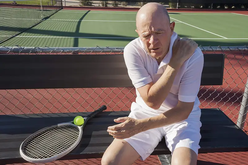Chiropractic Huntsville AL Elderly Man Tennis Shoulder